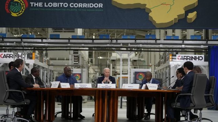 President Joe Biden, center, participates in the Lobito Corridor Trans-Africa Summit at the Carrinho food processing factory near Lobito, Angola, on Wednesday, Dec. 4, 2024  -  